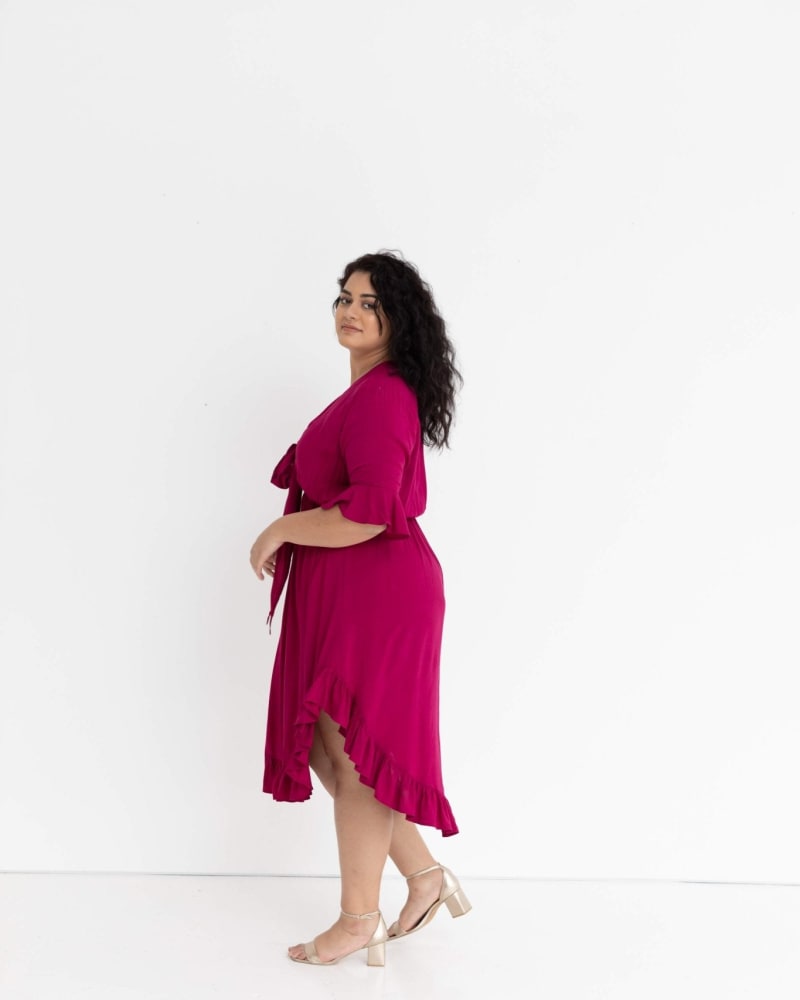 Side of a model wearing a size 12 Arielle Tie Front Midi Dress in French Plum by Dani Marie US. | dia_product_style_image_id:233421